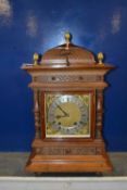 An early 20th Century continental Winterhalder and Hoffmeier mantel clock set in an architectural