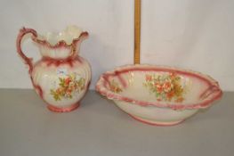 Pink decorated wash bowl and jug