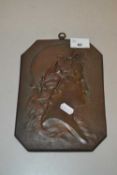 A copper portrait plaque with hanging loop, unsigned