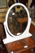 A small dressing table mirror in white painted frame