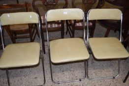 Four vintage metal framed folding chairs