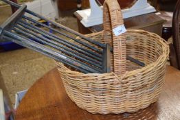 A wicker basket and a vintage wooden over bath shelf