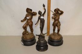 A group of three bronzed Spelter figures on turned bases