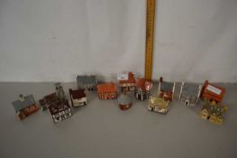 Collection of miniature pottery houses and churches