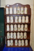 Collection of spice jars and accompanying wall rack