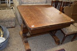 An oak drawer leaf dining table