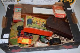 A box of various assorted games, toy cars etc