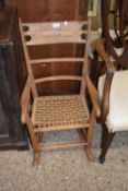 A small sisal seated rocking chair