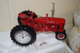 Model of a Farmall tractor