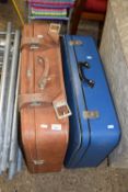 A set of vintage blue suitcases plus a further brown suitcase