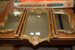 A gilt framed triple dressing table mirror