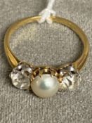 An unmarked yellow and white metal pearl and diamond ring, central button pearl with old cut diamond