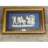 A Wedgwood Plaque, blue and white , in a gilt glazed frame, mounted, 27.5 x 42cm, see images