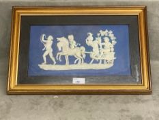 A Wedgwood Plaque, blue and white , in a gilt glazed frame, mounted, 27.5 x 42cm, see images