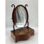 Oval mahogany dressing table mirror, with serpentine front and drawer to front