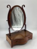 Oval mahogany dressing table mirror, with serpentine front and drawer to front