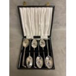 A set of Sterling silver 8 teaspoons with golf club finials boxed by Edward Viner, Sheffield