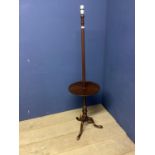 Wooden standard lamp on tripod base, with circular book stand to column