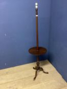 Wooden standard lamp on tripod base, with circular book stand to column