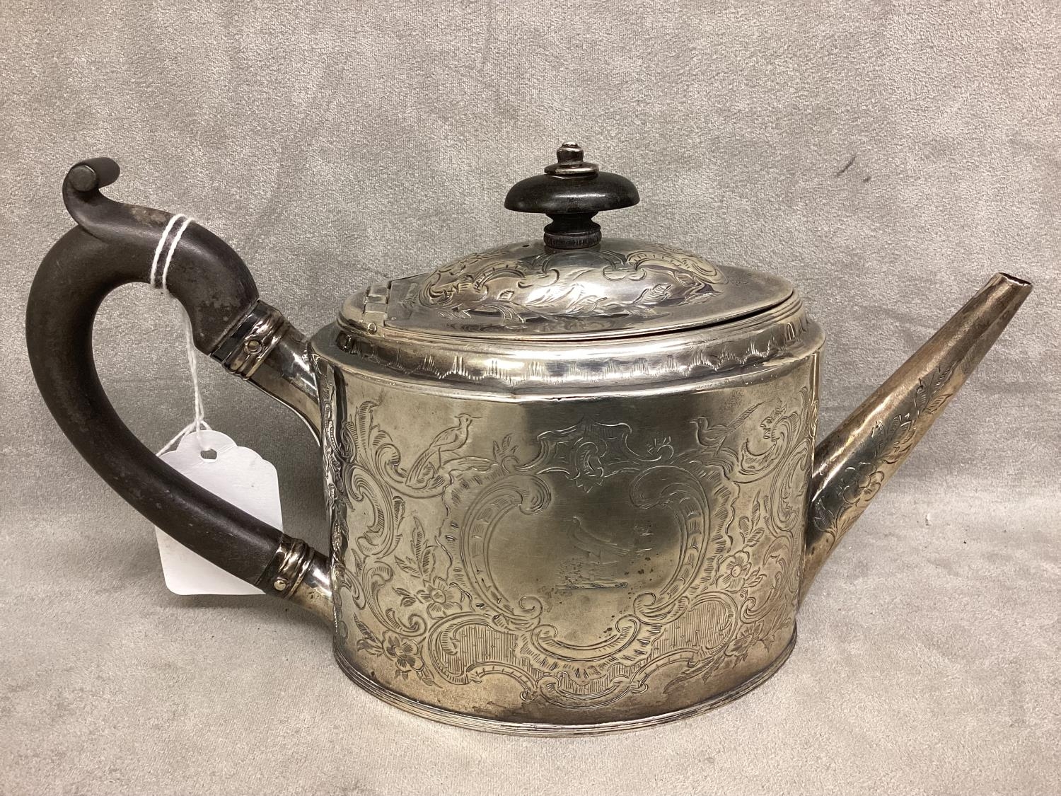 A Georgian Sterling silver Bachelors tea pot, ebonised handle with chased scrolling decoration by - Image 3 of 4