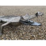 CLARE TUPMAN, British, Large sculpture of a crocodile, 250cm L. Notes: Clare Tupman, mother of 4,