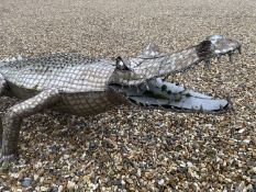 CLARE TUPMAN, British, Large sculpture of a crocodile, 250cm L. Notes: Clare Tupman, mother of 4,