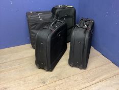 Quantity of flight luggage, including large black wheel cases, Samsonite and Antler