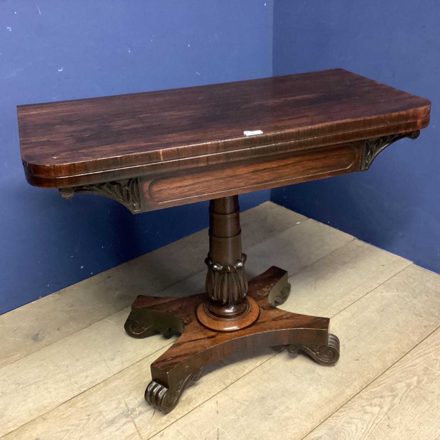 A mid C19th rosewood fold over card table, with baize interior
