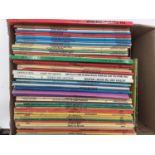 A large collection of Paperback Tin Tin and Asterix books