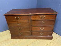 Modern, dark brown wood, low chest of drawers, the two left hand with internal hanging racks for