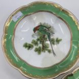 A Collection of Staffordshire plates, gilt green borders with central hand painted birds together