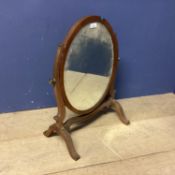 An Edwardian oval toilet mirror, much wear