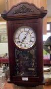 A modern mahogany wall clock, 31 day, by Canterbury