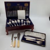A boxed canteen of electro plated cutlery together with a boxed plated fish server