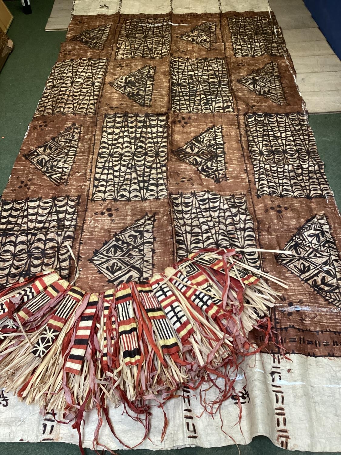A Tapa cloth (Masi) a large Fijian textile panel constructed from Mulberry Bark, 410cm x 190cm,