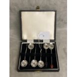 A boxed set of Sterling Silver coffee spoons with bean finials