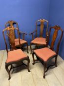 A set of four (2 +2carvers) mahogany dining chairs, with serpentine drop in orange upholstered
