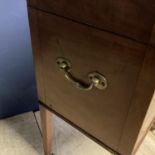 A good m mahogany wine cooler, with four tapered legs to castors, inside fitted metal wine