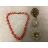 A collection of costume jewellery together with a strand of graduated carnelian beads