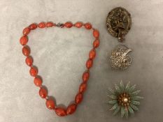 A collection of costume jewellery together with a strand of graduated carnelian beads