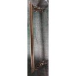 brass fire fender with decorative scrolling handles to each end