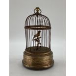 A Continental early C20th bird case Automaton, Clockwork mechanism, with gilt brass base, 28cmH