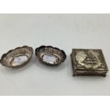 Pair of sterling silver oval pierced dishes and salts and a white metal trinket box