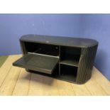 Modern side table with tambour front, opening to reveal shelves and pull out tray (as found, with