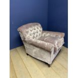 ANDREW MARTIN Large buttoned back armchair, upholstered in a velvet style mauve coloured designer