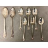 A set of six Sterling silver tea spoon, with scallop finials together with a pair of Sterling silver