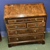 A good walnut bureau, the fitted interior with string and cross banded chequer board inlay, with