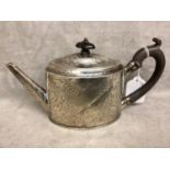 A Georgian Sterling silver Bachelors tea pot, ebonised handle with chased scrolling decoration by