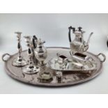 A large collection of silver plated and white metal items to include a large oval tray with loop