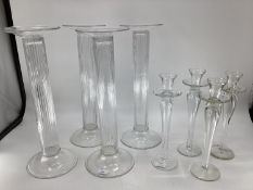 A quantity of decorative glass candlesticks
